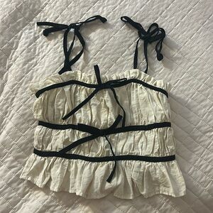 Cute cream and black cropped tank top with bows